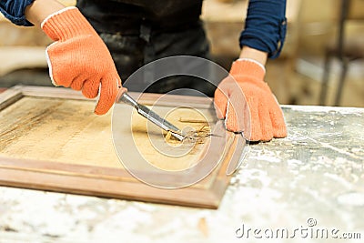 Carpenter using a wood gouge Stock Photo