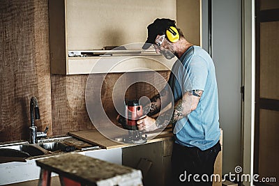 Carpenter woodworker working for house renovation Stock Photo