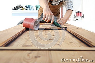 Carpenter work the wood with the rotary tool Stock Photo