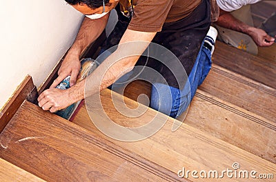 Carpenter working with electric sander Editorial Stock Photo