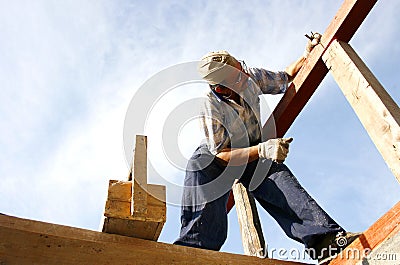 Carpenter working with nails and a box of tools Stock Photo