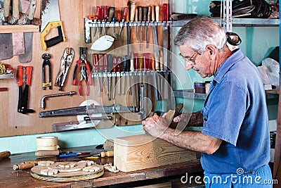 Carpenter working with wood Stock Photo