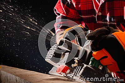 Carpenter works with electrical planer Stock Photo