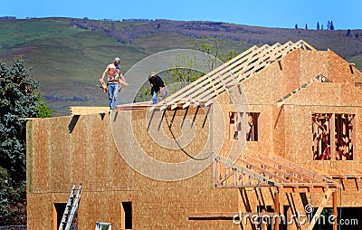 Carpenters Setting Trusses Stock Photo
