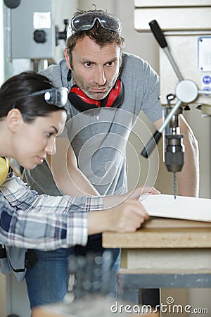 carpenters working with drill on wood Stock Photo