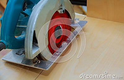 Carpentry tools, disc saw in ready to cut wood kitchen cabinet Stock Photo