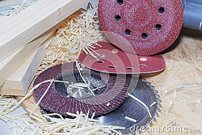 Carpentry tools on a wooden table with sawdust. Circular disk. Top view of the carpenter's workplace. Stock Photo