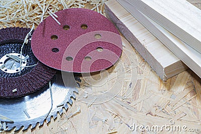 Carpentry tools on a wooden table with sawdust. Circular disk. Top view of the carpenter's workplace. Stock Photo
