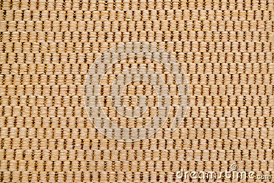 Carpet with alternating pattern of vertical beige columns in four thick woolen threads, based on thin brown threads on background Stock Photo