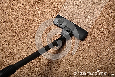Carpet cleaning, vacuum cleaner on dirty floor Stock Photo