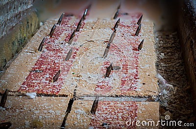 Carpet tack strip exposed during a flooring home improvement project Stock Photo