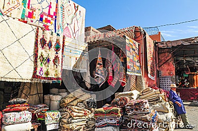 Carpet vendor in the souk, old town of Marrakesh Editorial Stock Photo