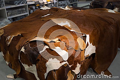 Carpets made out of natural cow leather for sale at a department store Stock Photo