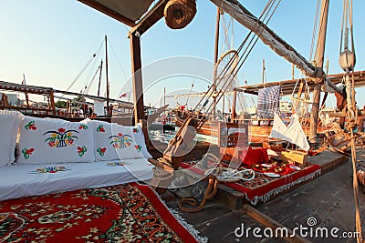 Carpets and traditional Arabia decoration on a dhow deck on the Dhow festival . Stock Photo