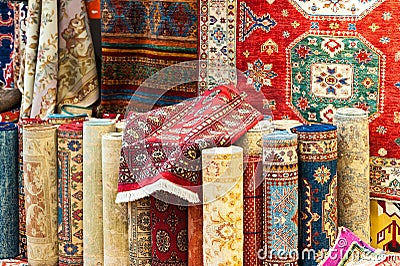 Carpets variety selection rolled up rugs shop store Stock Photo