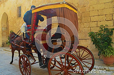 Carriage on a narrow street of ancient Mdina in Malta Editorial Stock Photo