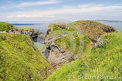 The Carrick-a-Rede rope bridge on the north Antrim coast, Northern Ireland on a sunny day Stock Photo