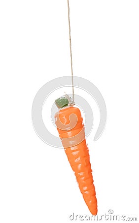 Carrot dangling on a string Stock Photo