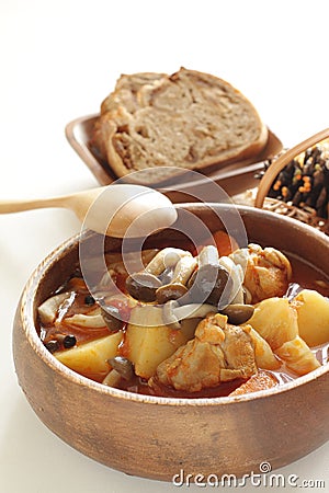 Chicken red soup and mushroom curry in white bowl Stock Photo