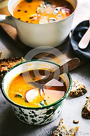 Carrot and Pumpkin soup with Basil oil Stock Photo