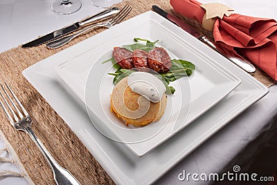 Carrot souffle with sour cream with ciboulette and salad. Stock Photo