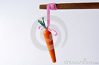 Carrot or stick approach idiom Stock Photo