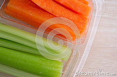 Carrot sticks and celery sticks in plastic tray Stock Photo