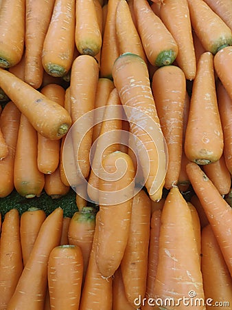 Carrot top view on display Stock Photo