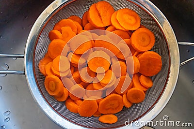 Carrots cut in a sieve Stock Photo