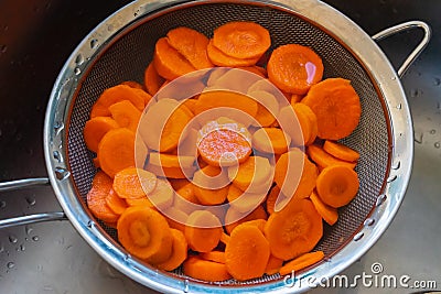 Carrots cut in a sieve Stock Photo