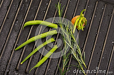 Carrots organic in green leaf on metal grill Stock Photo