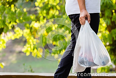 Carry Plastic Bags in the Park Stock Photo