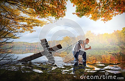 Carrying the cross on a lake Stock Photo