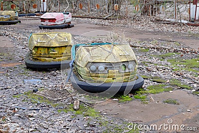 Cars in an abandoned amusement park in Pripyat. Rusty deserted attractions Editorial Stock Photo