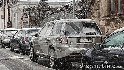 Cars covered in snow, first day of winter Editorial Stock Photo