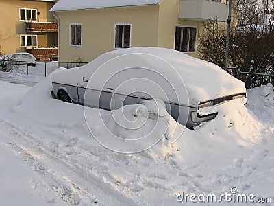 Cars covered in snow on a street in town in Karlskrona Editorial Stock Photo
