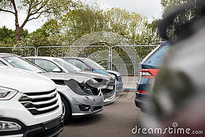 Cars Damaged In Motor Vehicle Accidents Parked In Garage Repair Shop Stock Photo