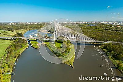 Cars drive on cable-stayed Redzinski Bridge over river Stock Photo