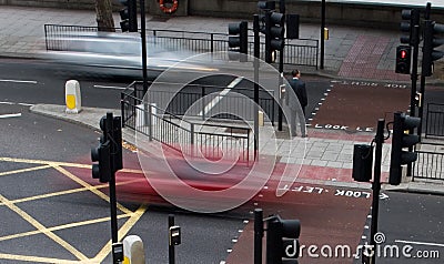 Cars driving through crosswalk Stock Photo