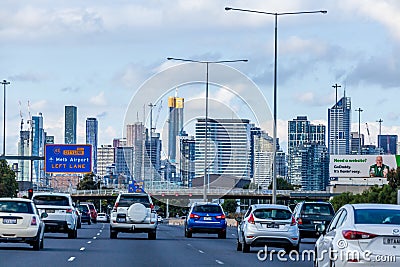 Cars driving towards the city CBD with road signage to Melbourne Airport Editorial Stock Photo