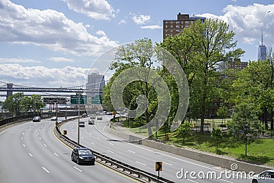 Cars on FDR Drive along East River with a view on lower Manhattan Stock Photo