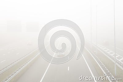 Cars in heavy fog on the A2 motorway around Amsterdam Stock Photo