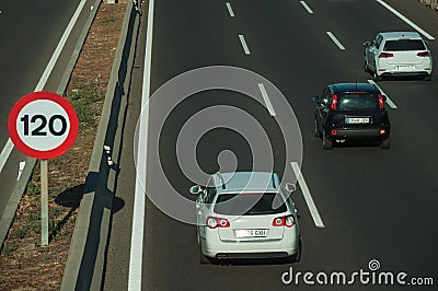Cars on highway and SPEED LIMIT signpost in Madrid Editorial Stock Photo