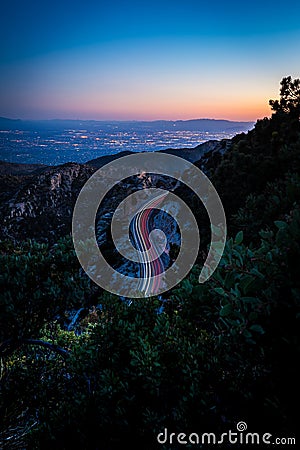 Cars with long exposure driving on the road on Mount Lemmon in the evening in Arizona Stock Photo