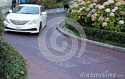 Cars maneuvering down the Lombard Street, Crooked Street, Francisco Editorial Stock Photo