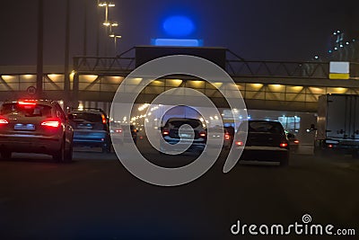 Cars move in several rows under footbridge. Stock Photo
