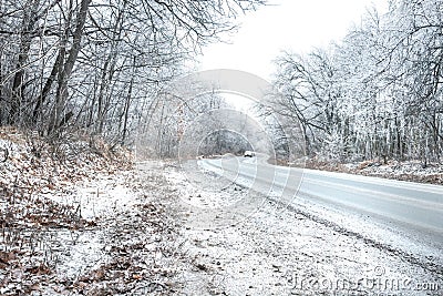 Cars move on winter snowy driving journey on forest road Stock Photo