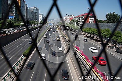 Cars moving fast on a busy multi lane highway in city of Beijing in China Editorial Stock Photo