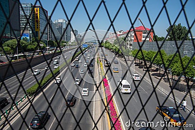 Cars moving fast on a busy multi lane highway in city of Beijing in China Editorial Stock Photo