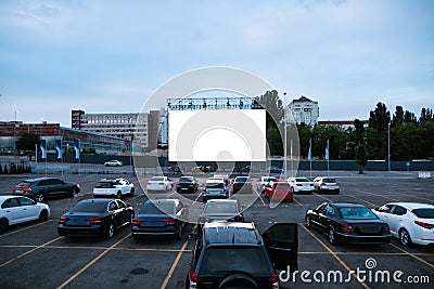 Cars parked in autocinema during evening session Stock Photo